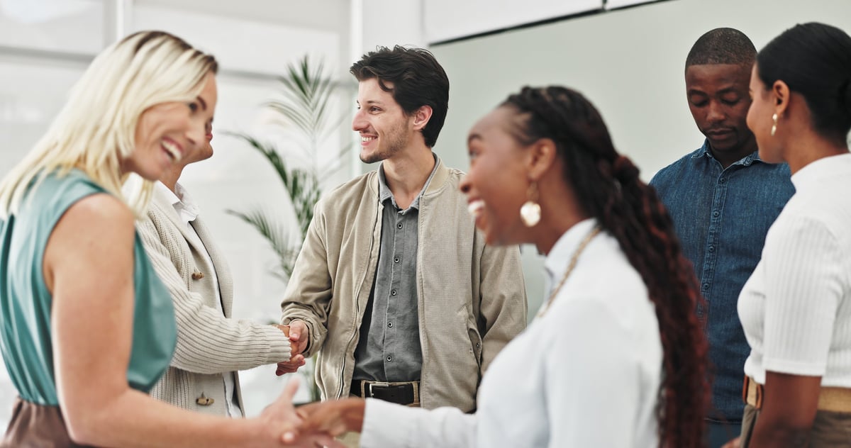 Business professionals networking and shaking hands