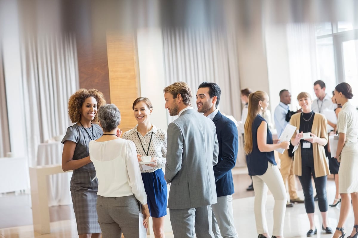 Professionals networking at a business event